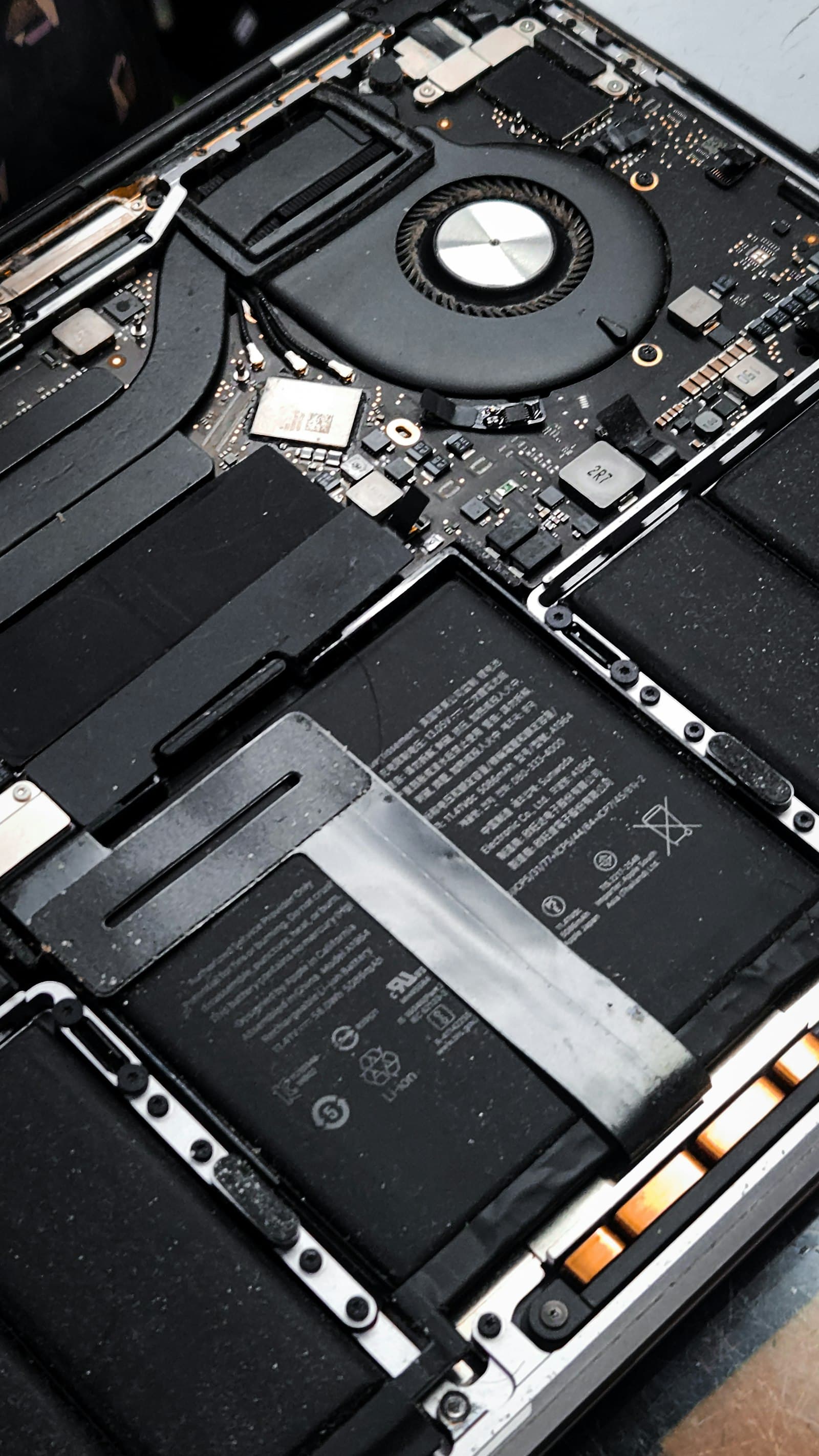 Opened laptop showing internal components during a repair